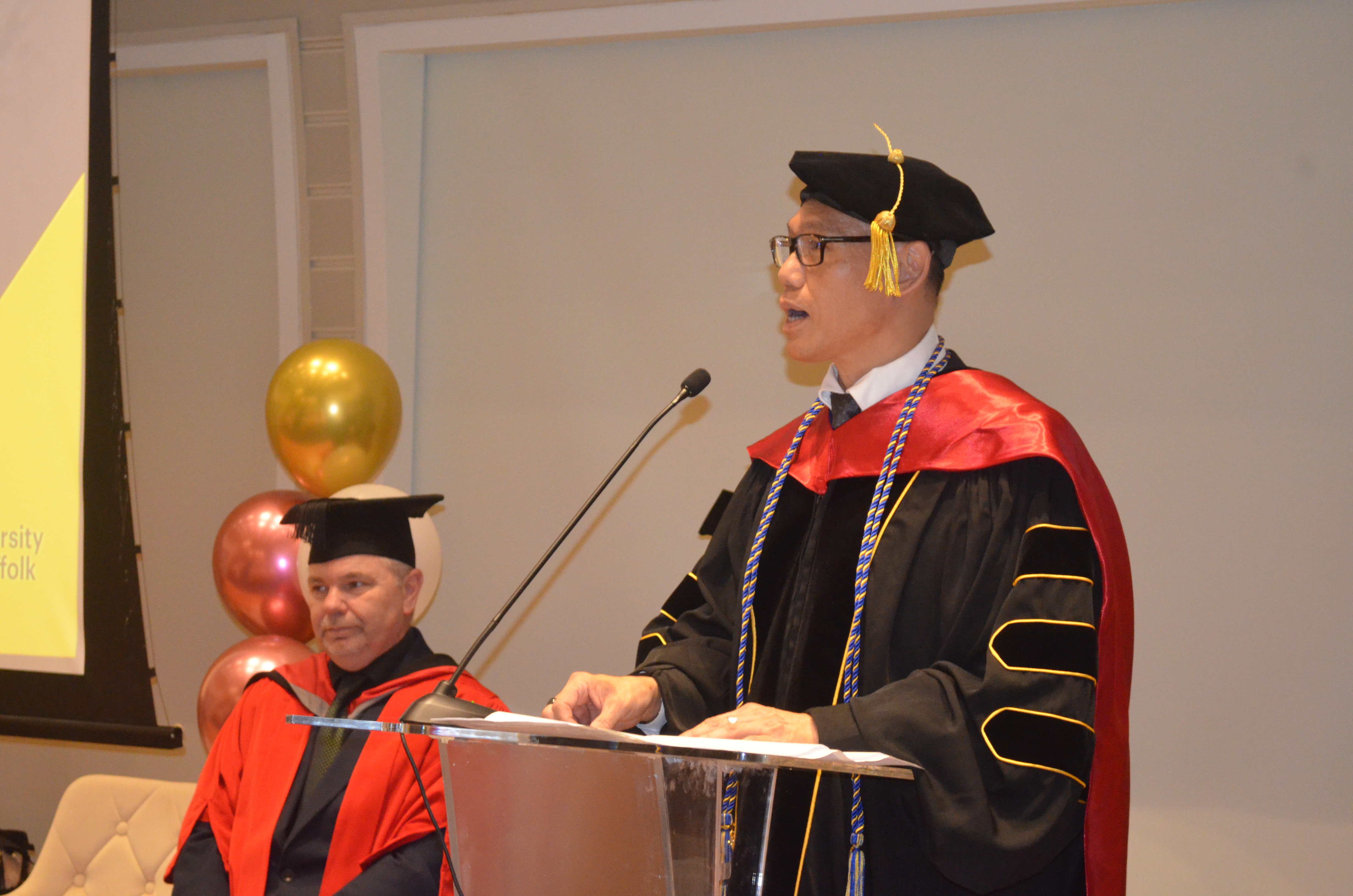 Dr Alan Go addressing graduates