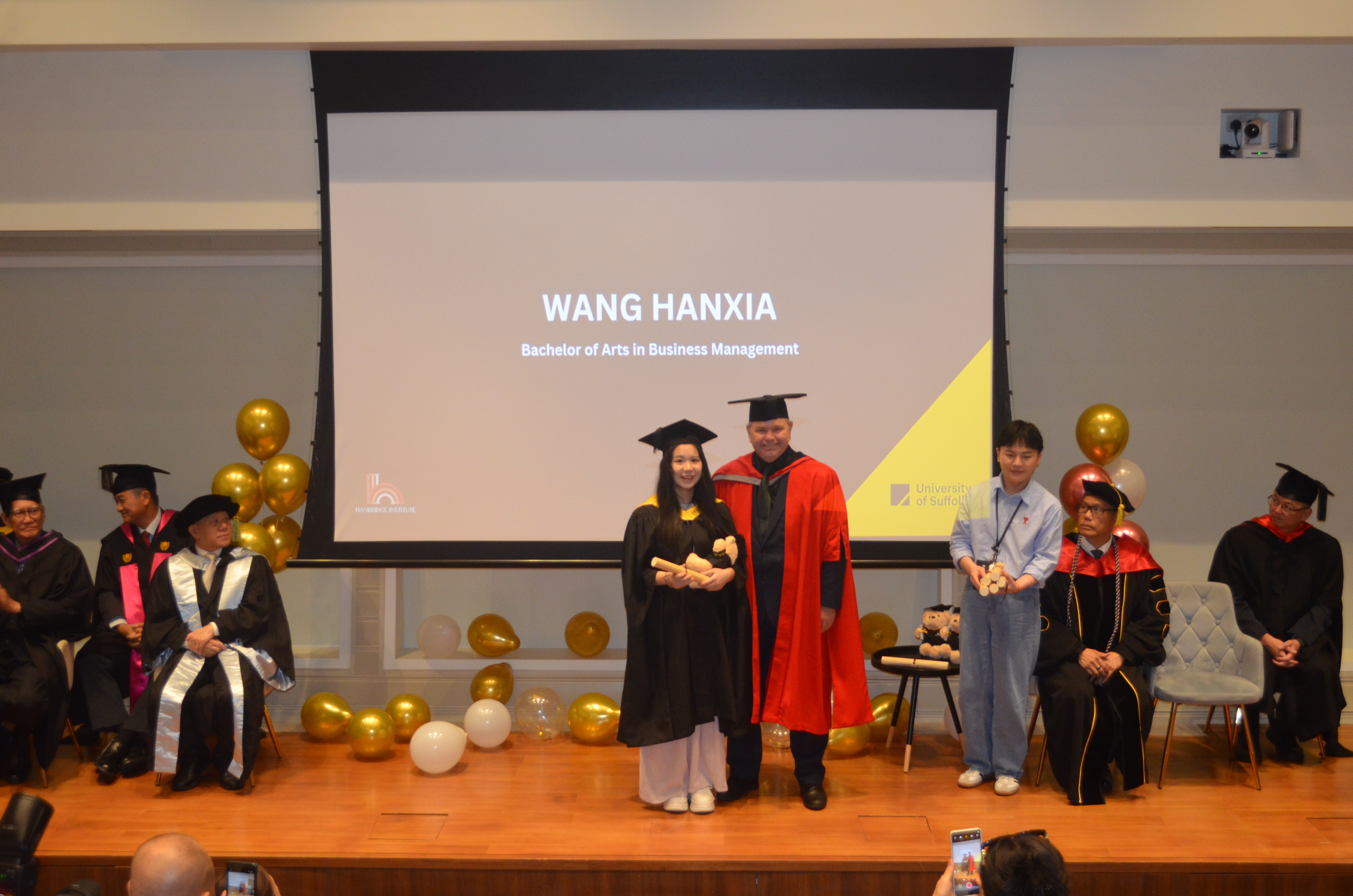 Handshake with faculty during certificate presentation