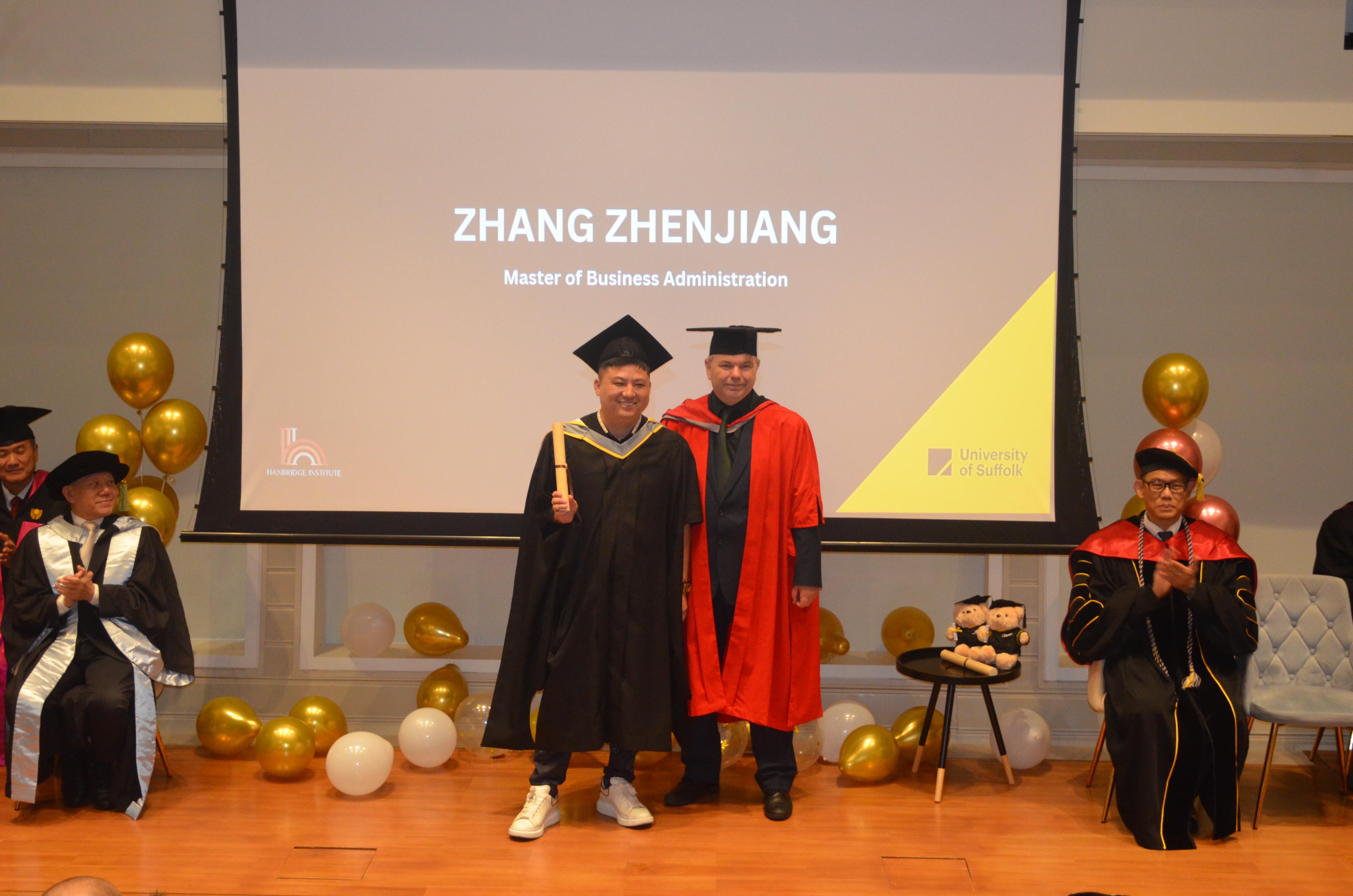 Graduate receiving certificate on stage