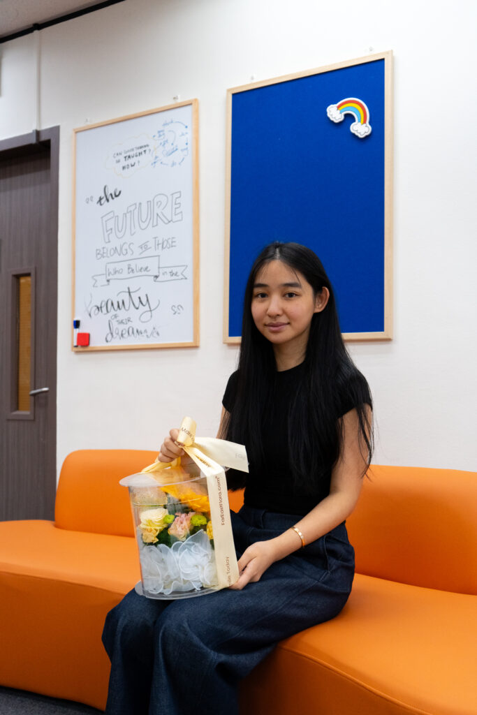 Celebratory atmosphere at Hanbridge Institute Singapore as teachers receive flowers from happy parents on S-AEIS results day.