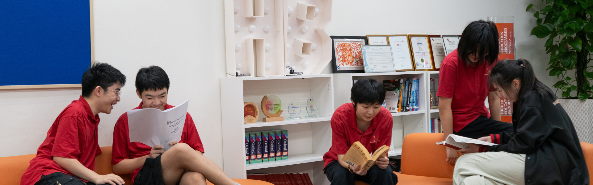 The Hanbridge Institute campus foyer featuring the school logo and modern facilities for AEIS and GCE O-Level preparatory courses.