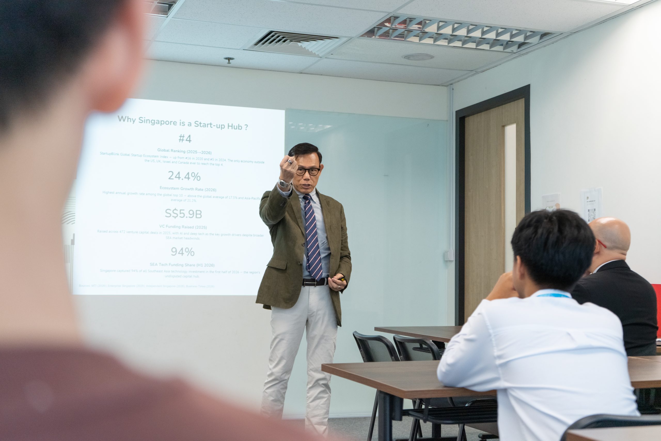 Dr Alan Go sharing insights on Singapore's education system, entrepreneurship, and innovation during the MOU event.