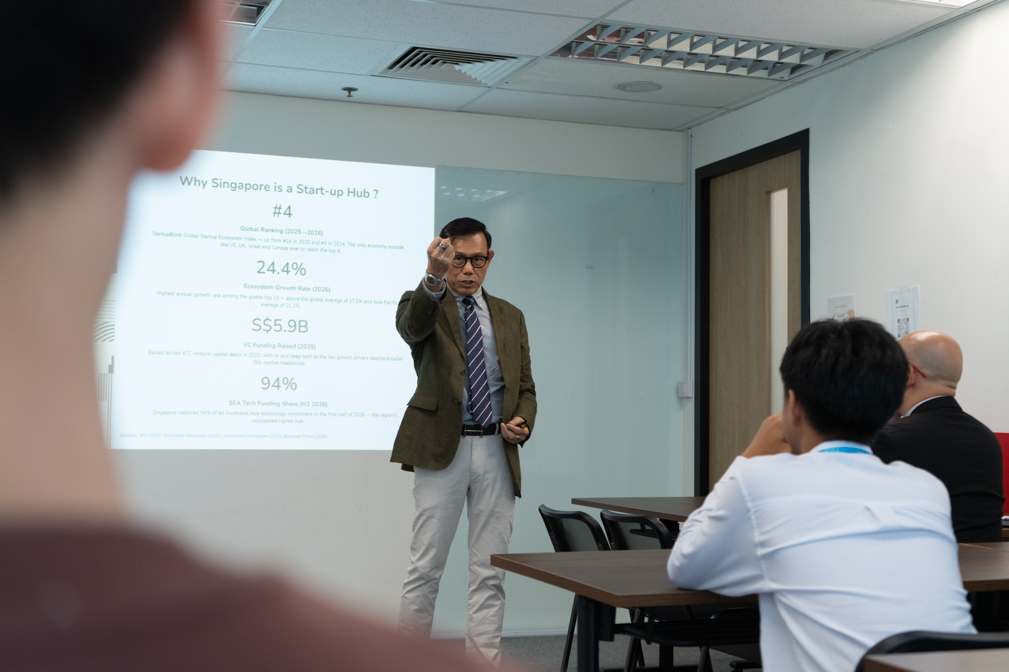 Dr Alan Go sharing insights on Singapore's education system, entrepreneurship, and innovation during the MOU event.