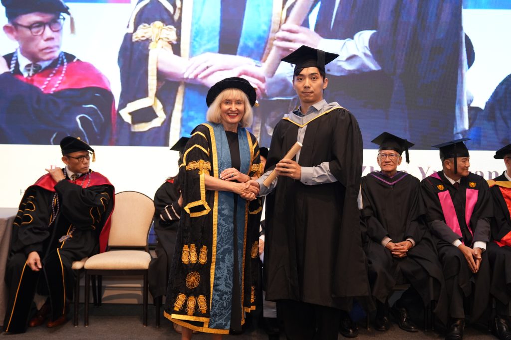 Professor Jenny Higham presenting University of Suffolk graduation certificates to Hanbridge Institute graduates