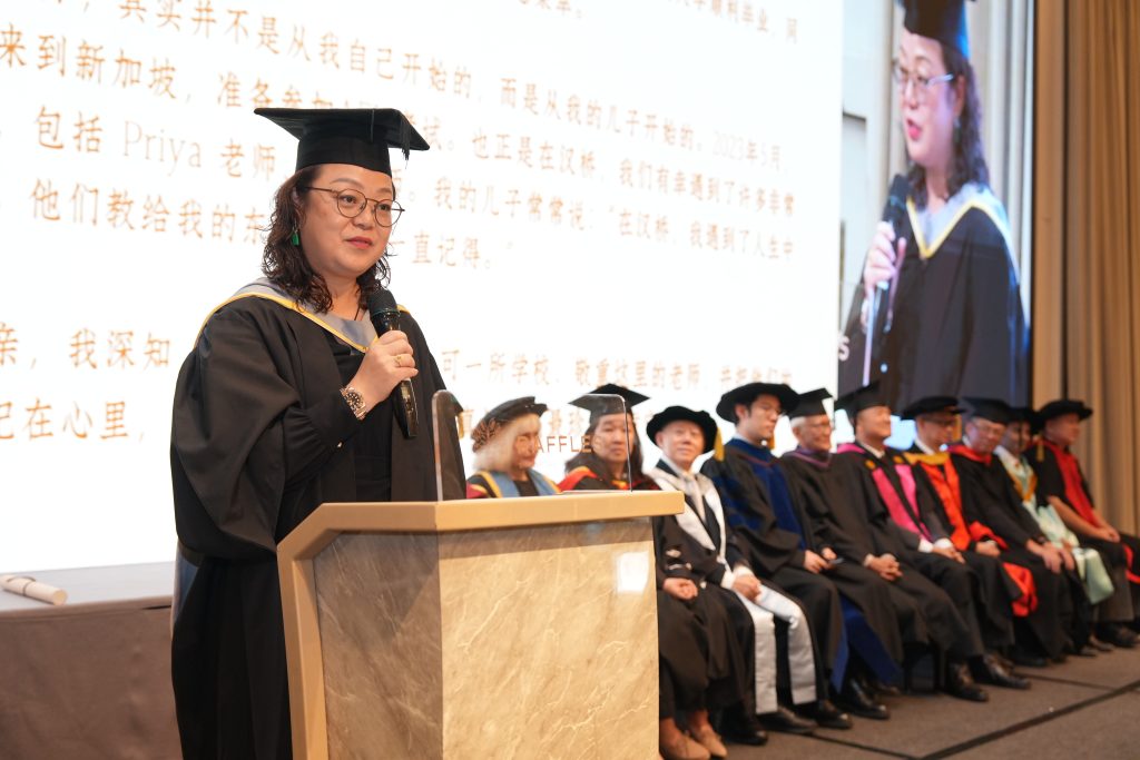 MBA graduate and valedictorian Cao Hui delivering her speech at Hanbridge Institute Graduation 2026