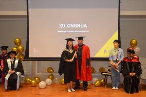 Stuart Agnew from the University of Suffolk presenting awards to graduates at Hanbridge Institute's Graduation 2025 ceremony